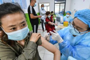 A dose of a Sinopharm COVID-19 vaccine is administered in Fuyang, China.Credit: Sheldon Cooper/SOPA Images/Shutterstock